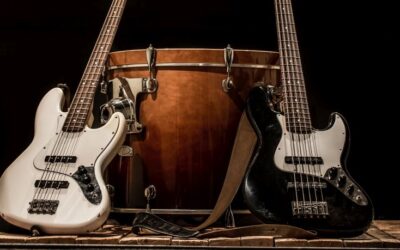 musical instruments, drum bass Bochka bass guitar on a black background, the music concept